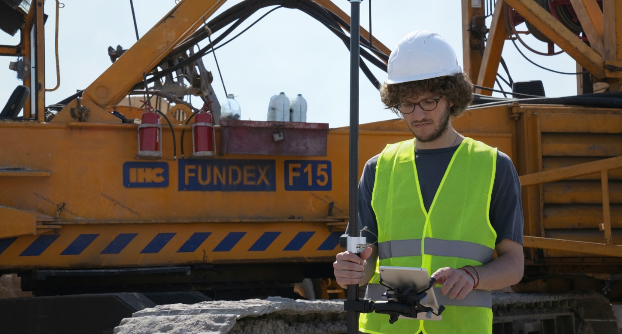 Construction worker on mobile device