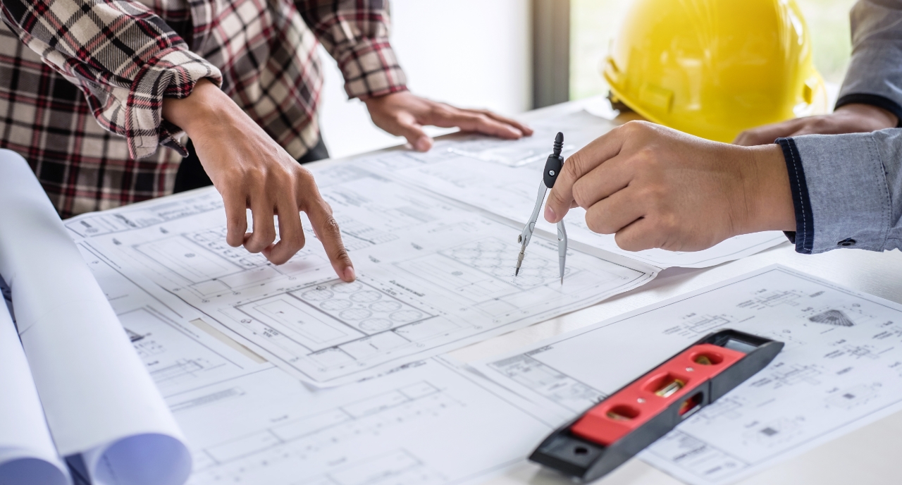 Construction engineer discussing a blueprint