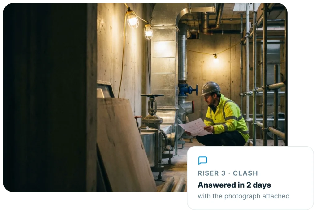 Services engineer checking a drawing in a riser, with an Insite card showing a clash answered in two days with the photograph attached