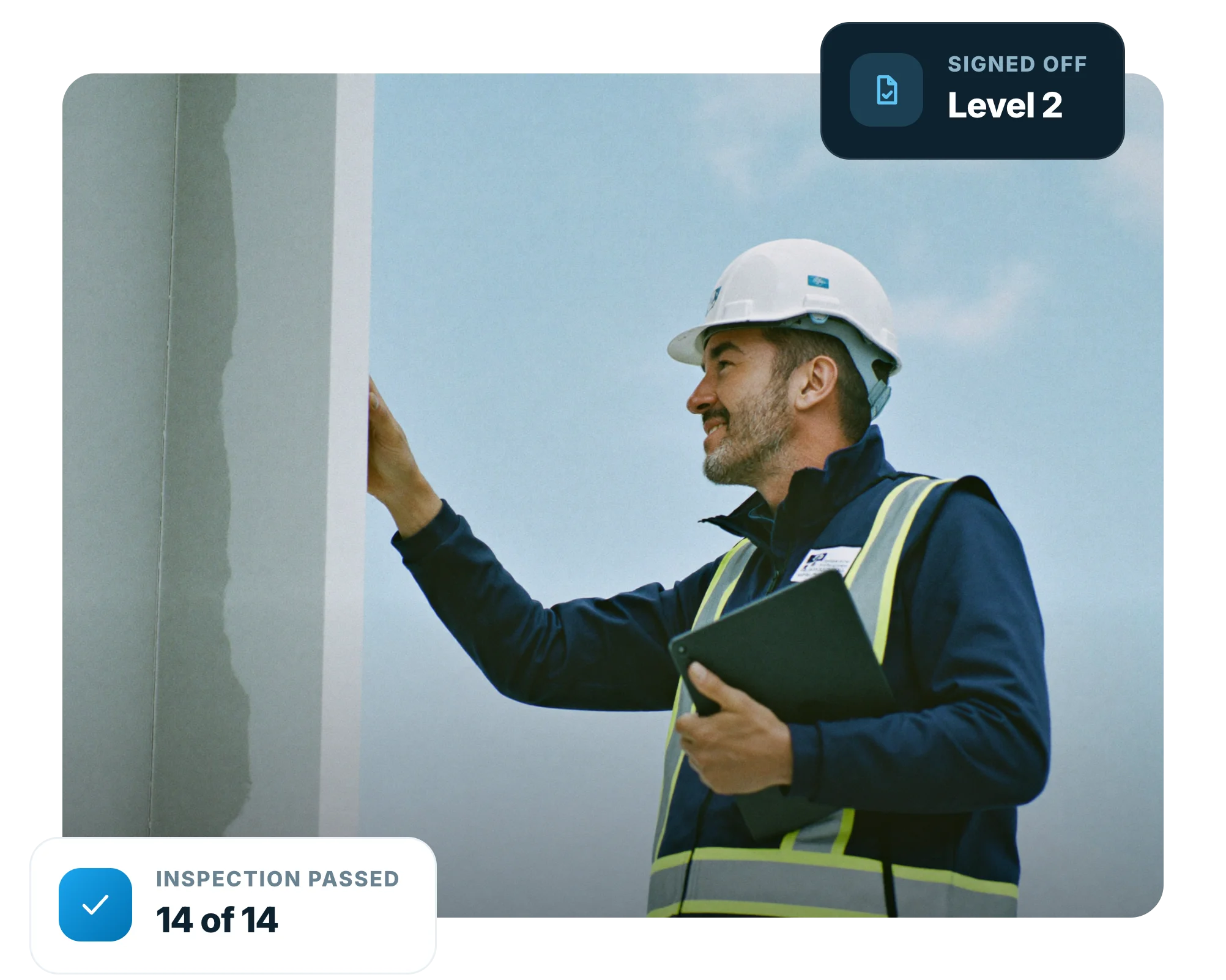 Site engineer completing a construction quality inspection on a phone on site