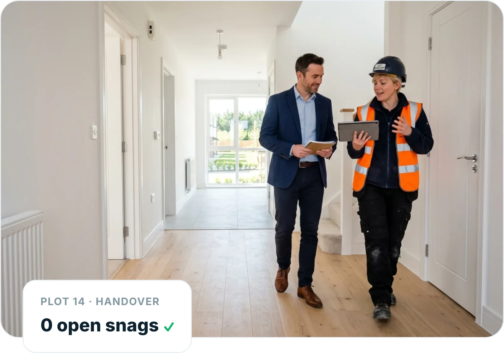 Site manager and client walking a finished plot at handover with zero open snags recorded in Insite