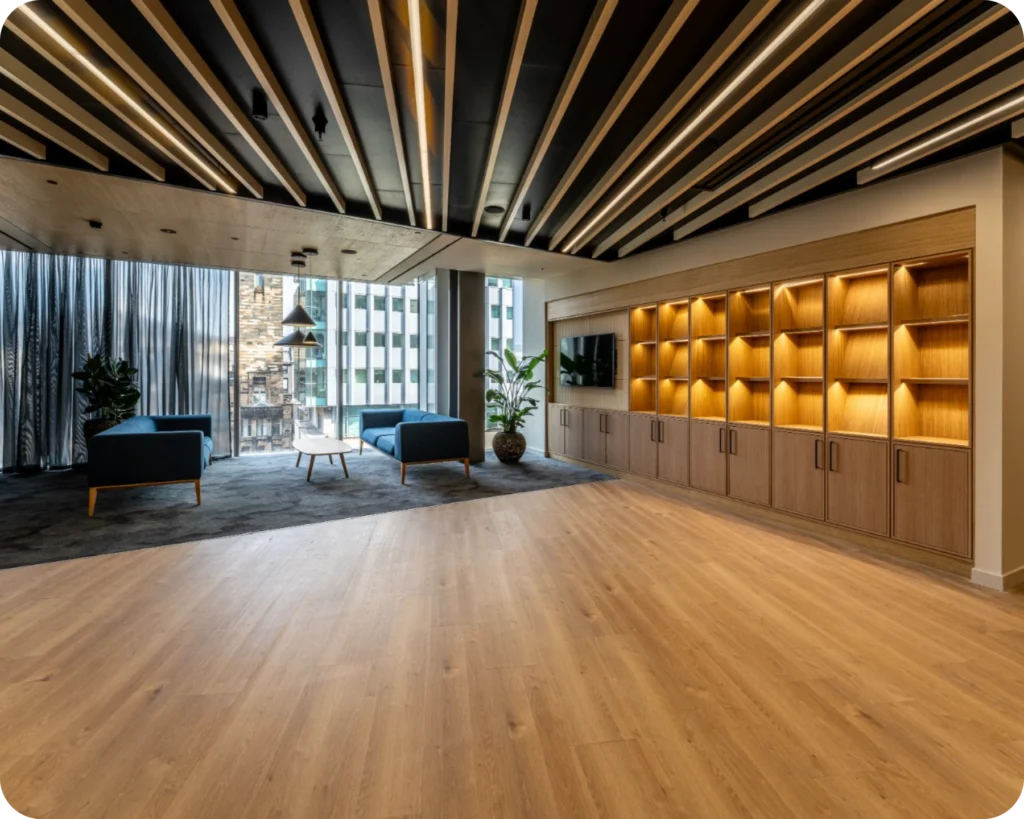 Finished office fit-out by MPACT Group with timber slatted ceiling, lit joinery and lounge seating